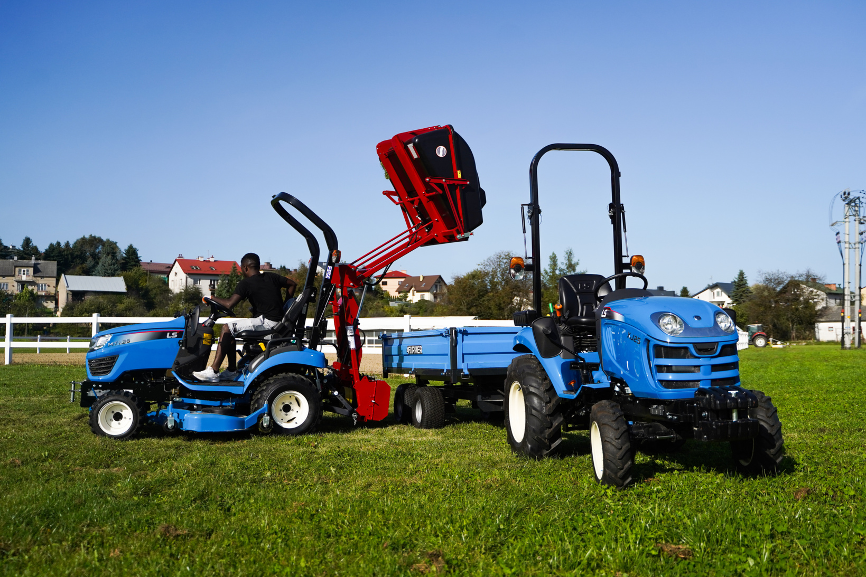 LS machines cutting grass for the fair